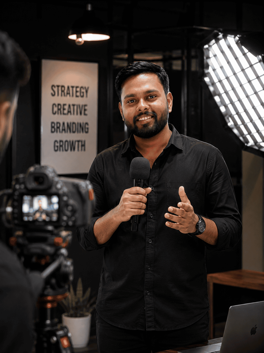 Professional man speaking confidently during a video shoot at Eightfy.